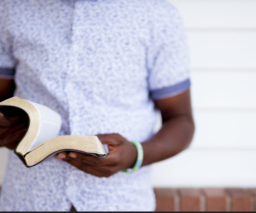 Student holding a Bible